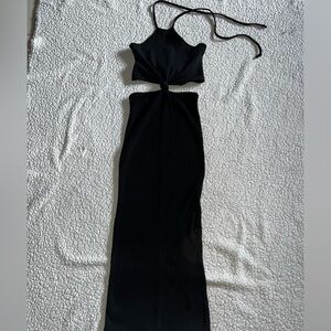 Black dress with a knot design. Never worn.